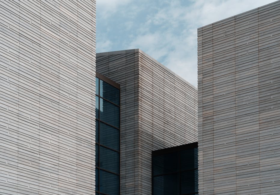 Contemporary minimalist building facade with clear sky background